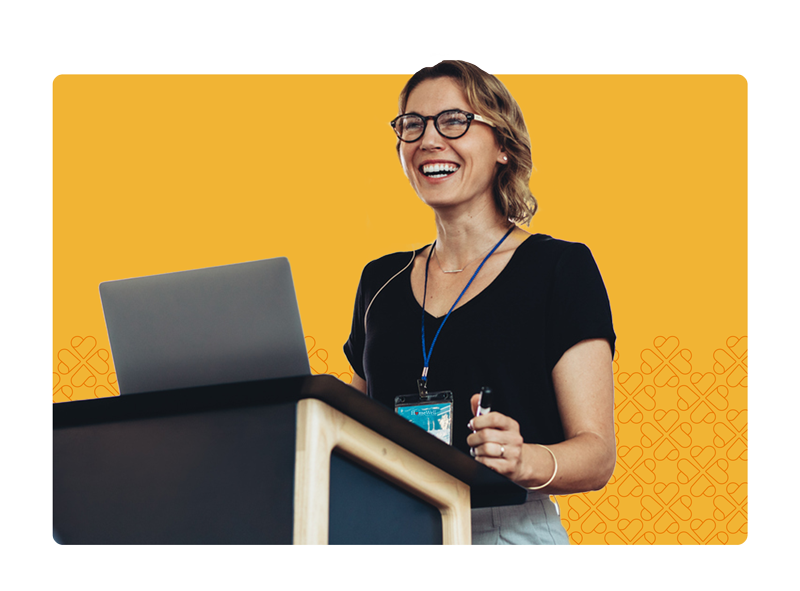 Respite-Care-Horizontal-Header Woman with glasses on standing desk with laptop